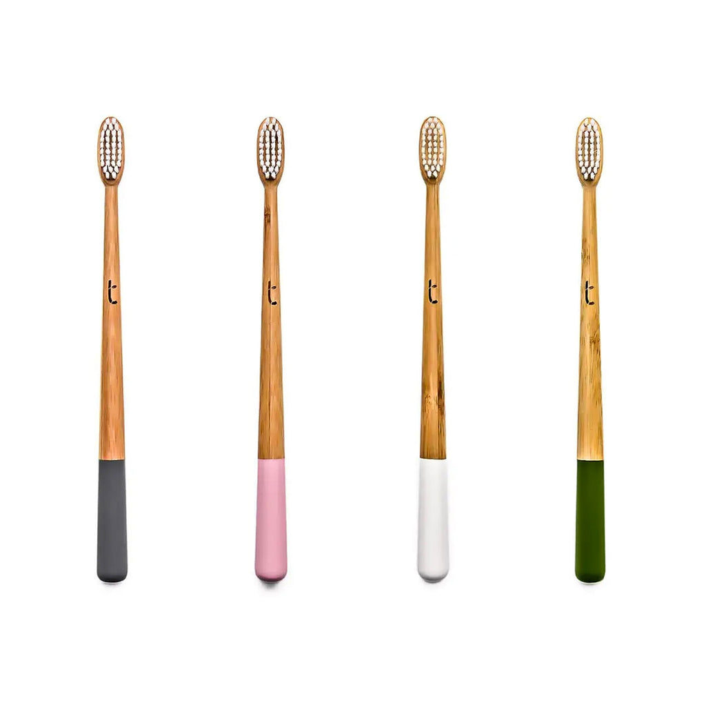 bamboo toothbrushes in gray, pink, white, or green